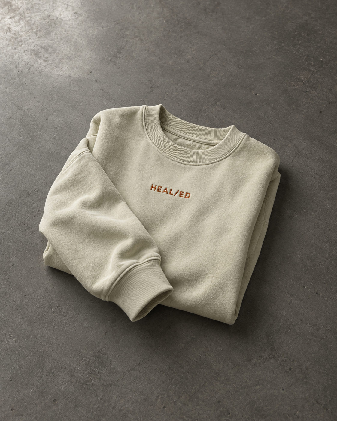 The Vision Crew garment folded on a dark surface